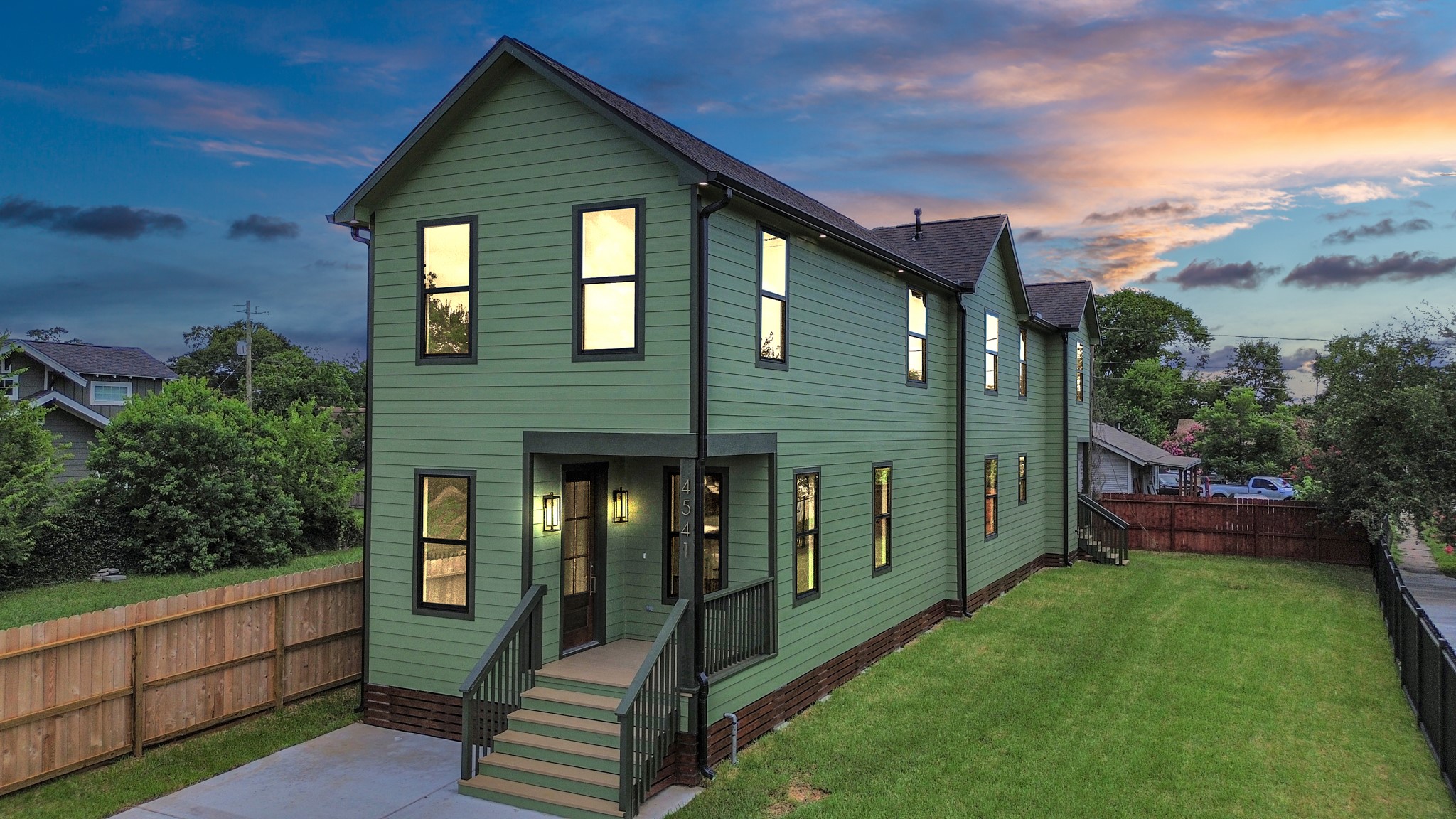 4541 Walker Street Houston, TX 77023 - Photo 22 of 24 a front view of a house with garden