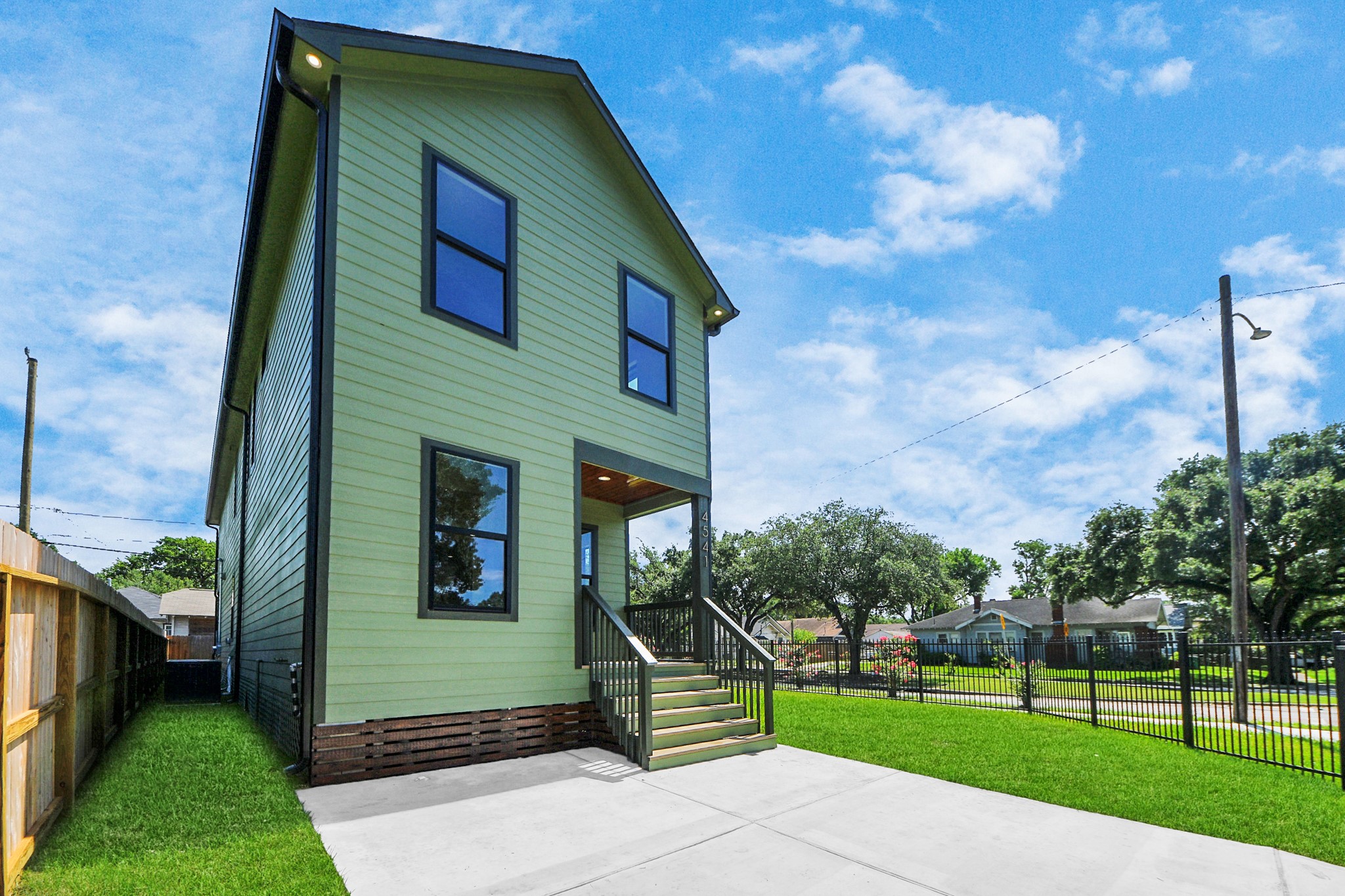 4541 Walker Street Houston, TX 77023 - Photo 23 of 24 a front view of a house with a yard