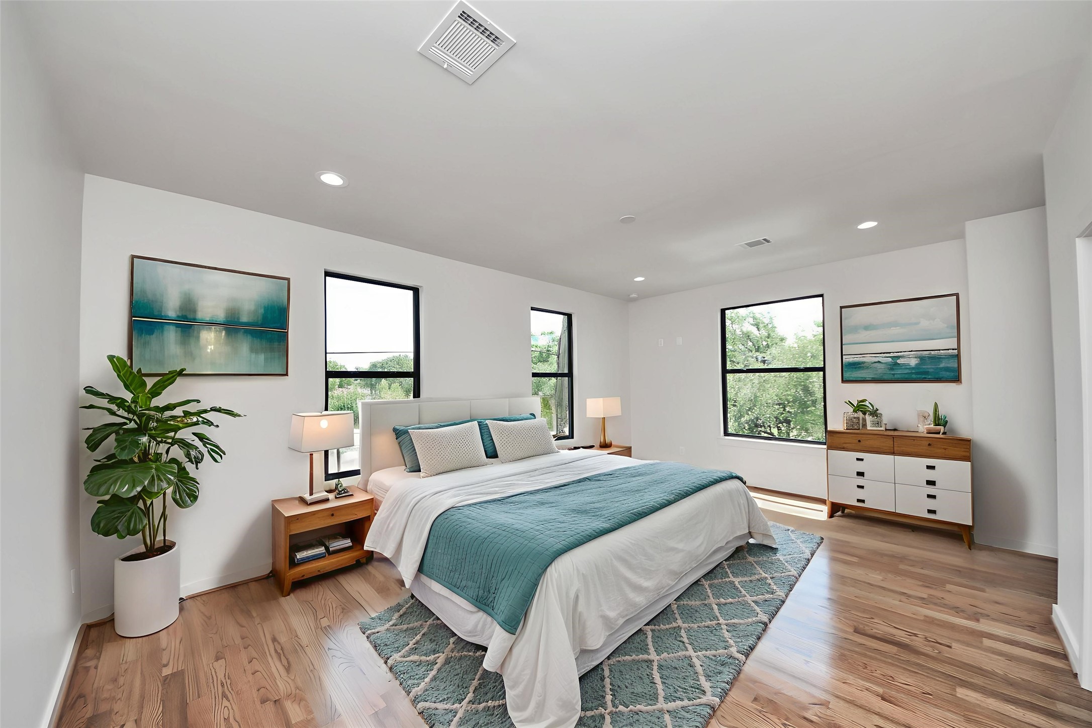 4541 Walker Street Houston, TX 77023 - Photo 3 of 24 a bedroom with a bed and large windows