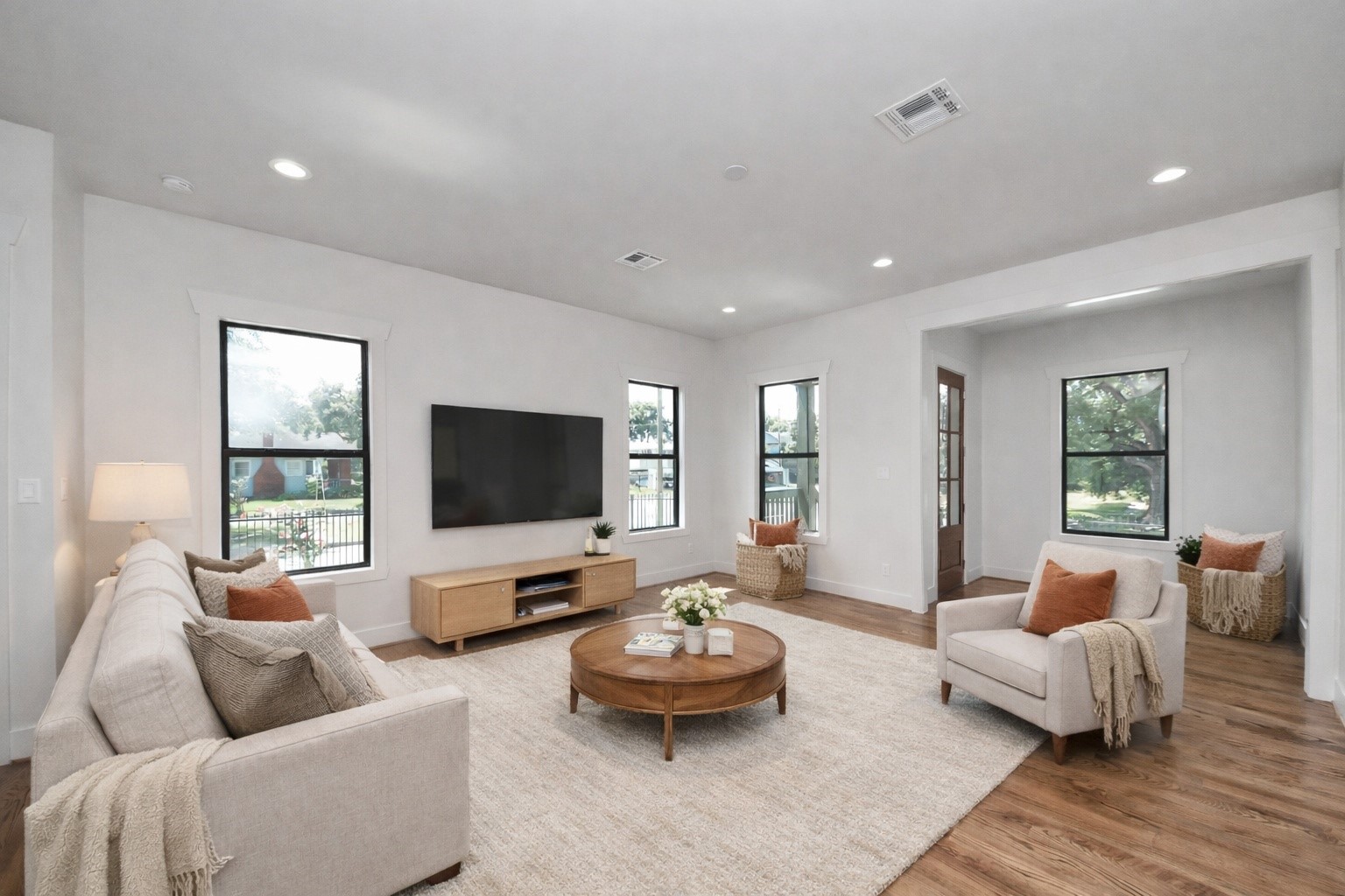 4541 Walker Street Houston, TX 77023 - Photo 8 of 24 a living room with furniture and a flat screen tv