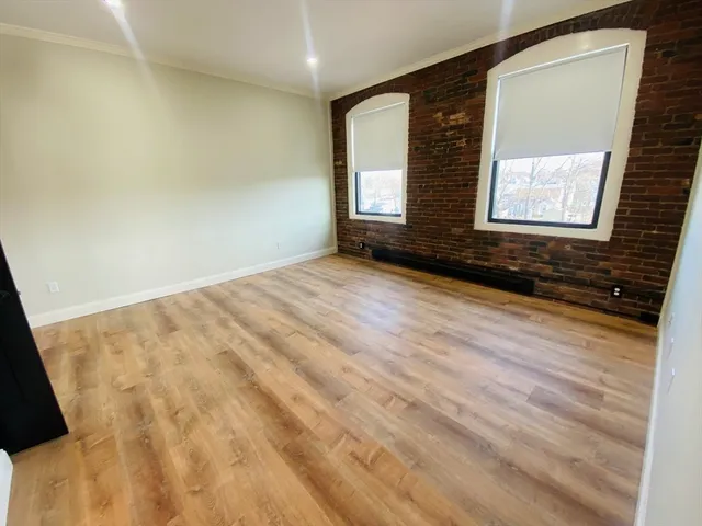 a view of an empty room and window