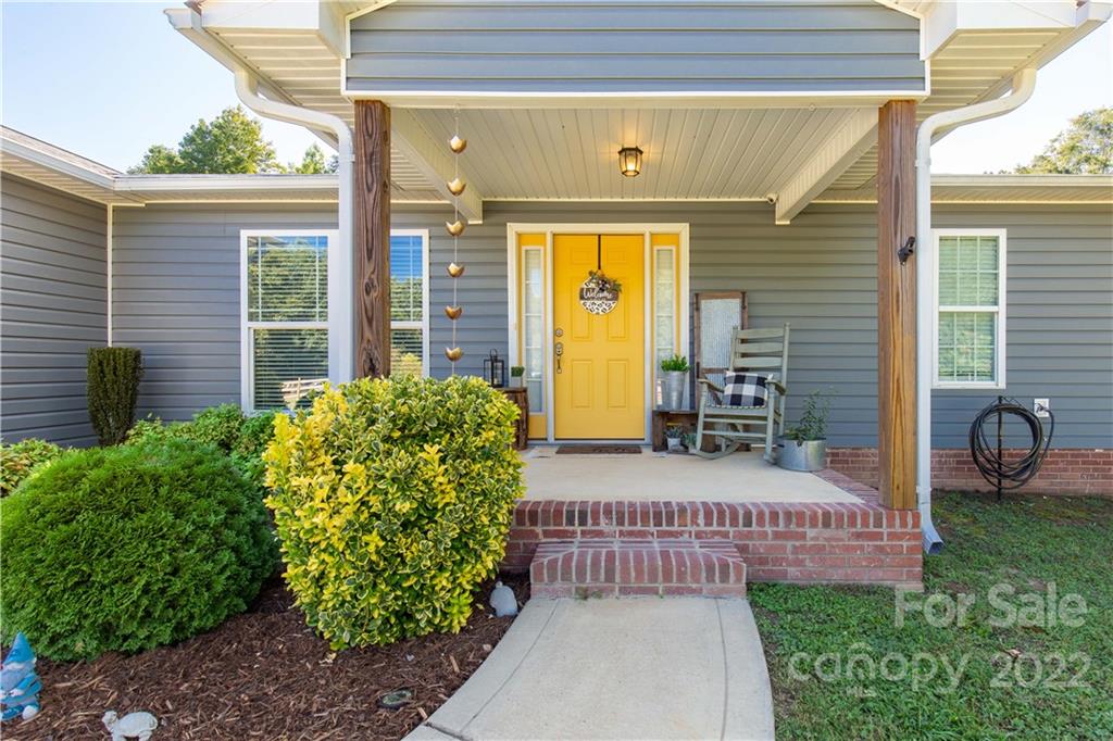 2098 Beamguard Road Clover, SC 29710 - Photo 3 of 36 a view of a porch with a table and chairs and potted plants