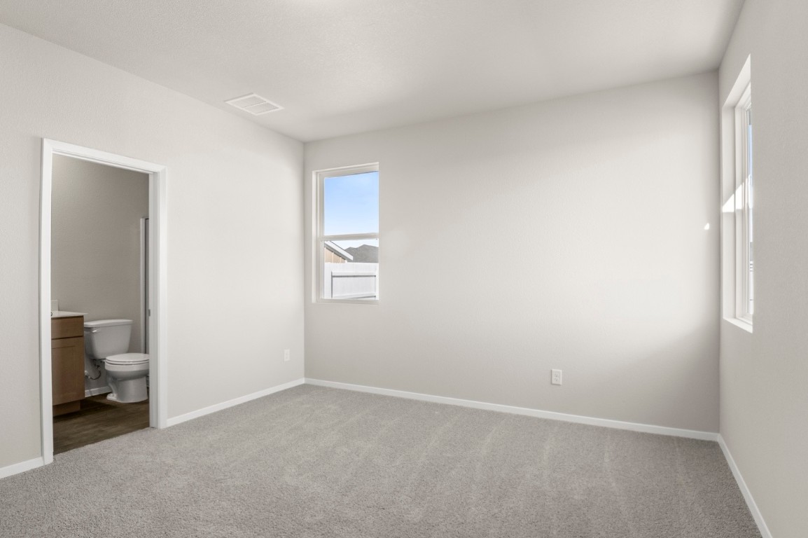167 Daylily Drive Elgin, TX 78621 - Photo 19 of 29 an empty room with a bathroom