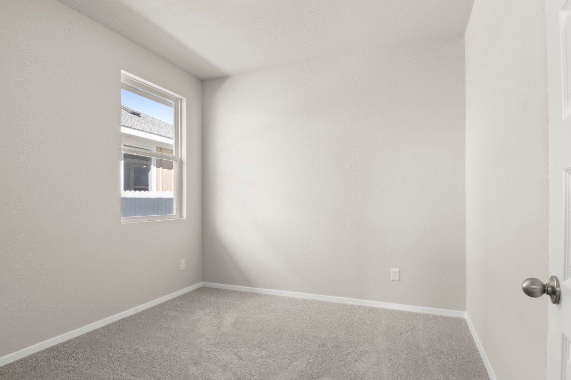 167 Daylily Drive Elgin, TX 78621 - Photo 24 of 29 a view of an empty room with a window