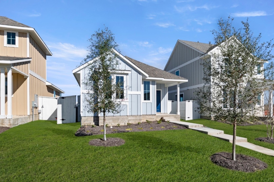 167 Daylily Drive Elgin, TX 78621 - Photo 4 of 29 a front view of a house with a yard