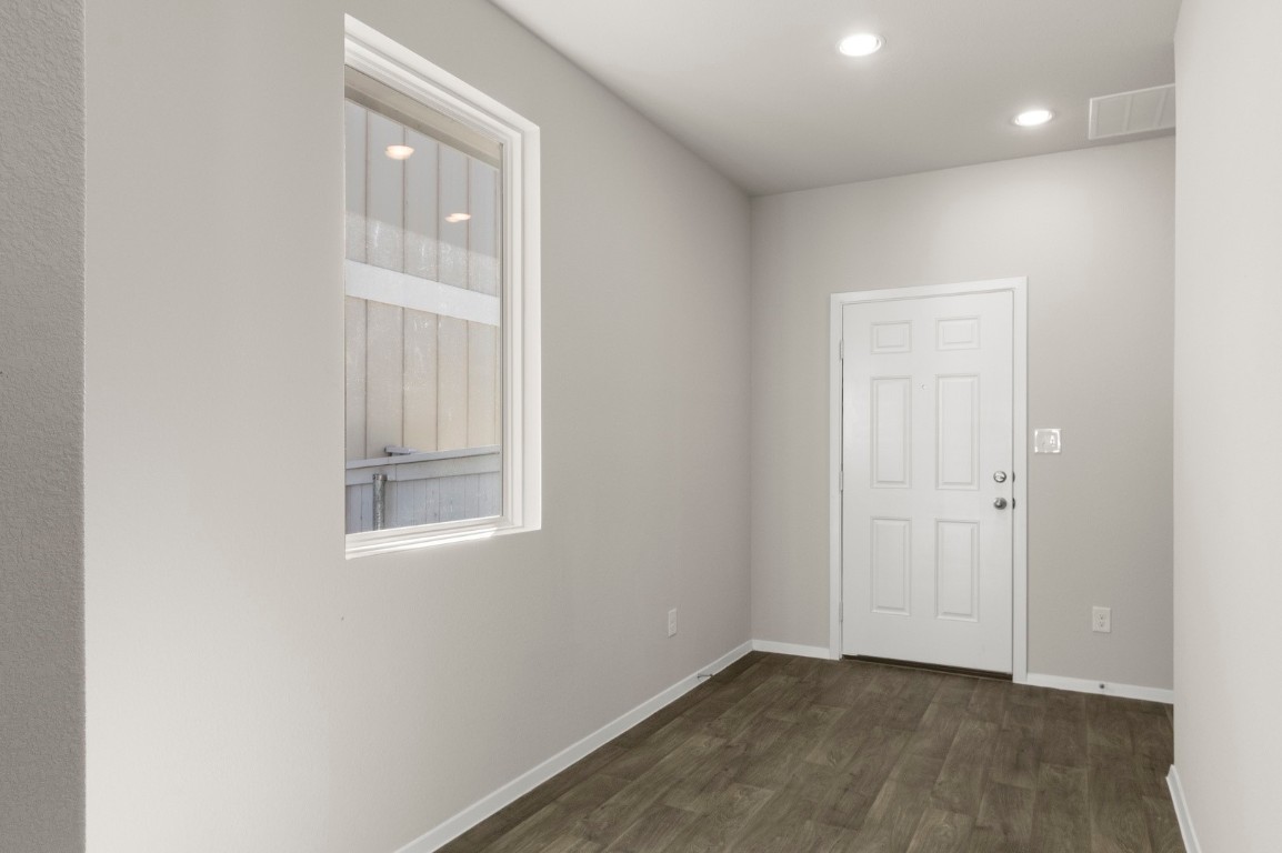 167 Daylily Drive Elgin, TX 78621 - Photo 7 of 29 an empty room with windows