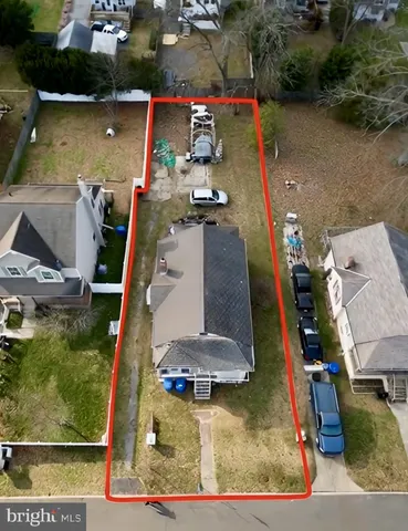 an aerial view of houses with outdoor space