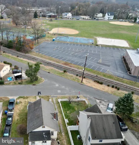 a view of a swimming pool with a yard