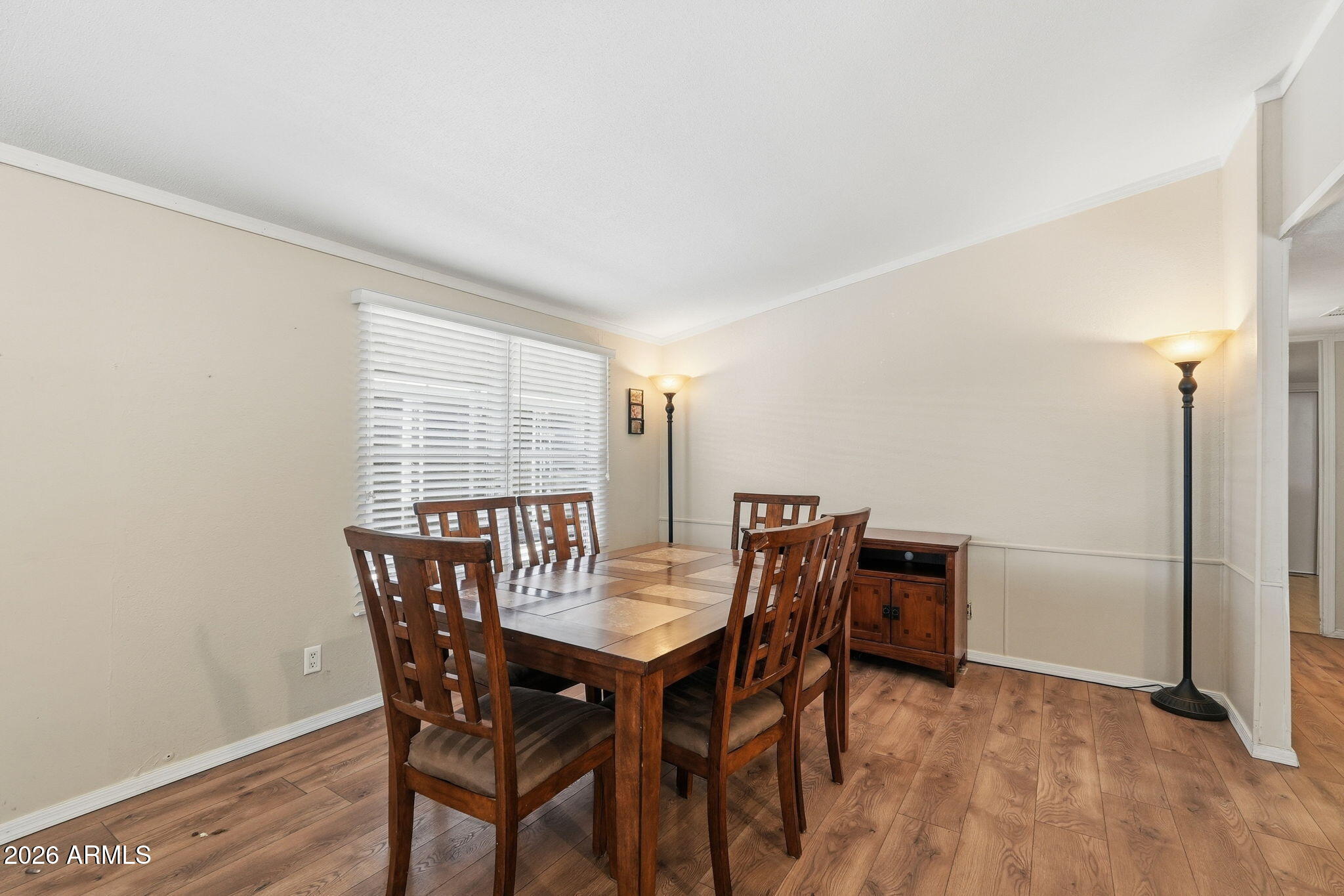 53 North Mountain Road, Unit 38 Apache Junction, AZ 85120 - Photo 15 of 35 a view of a dining room with furniture and wooden floor