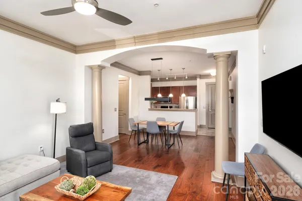 a living room with furniture and a flat screen tv
