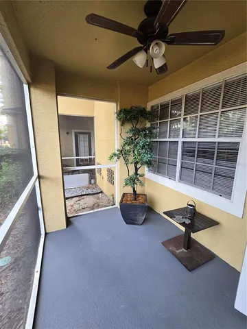 a view of a livingroom with furniture and a window