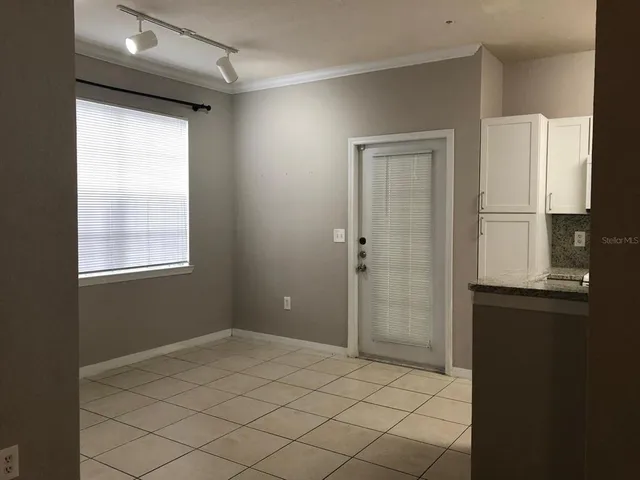 a bathroom with a shower and a sink