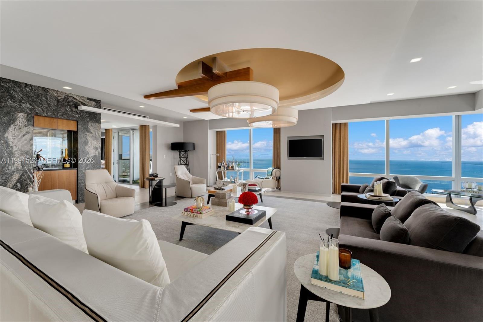 1425 Brickell Avenue, Unit PH2ABCD Miami, FL 33131 - Photo 12 of 20 a living room with furniture and a large window