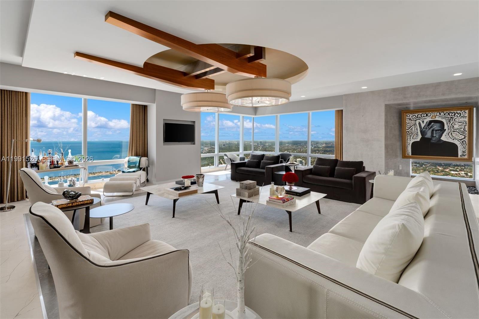 1425 Brickell Avenue, Unit PH2ABCD Miami, FL 33131 - Photo 2 of 20 a living room with furniture and a large window