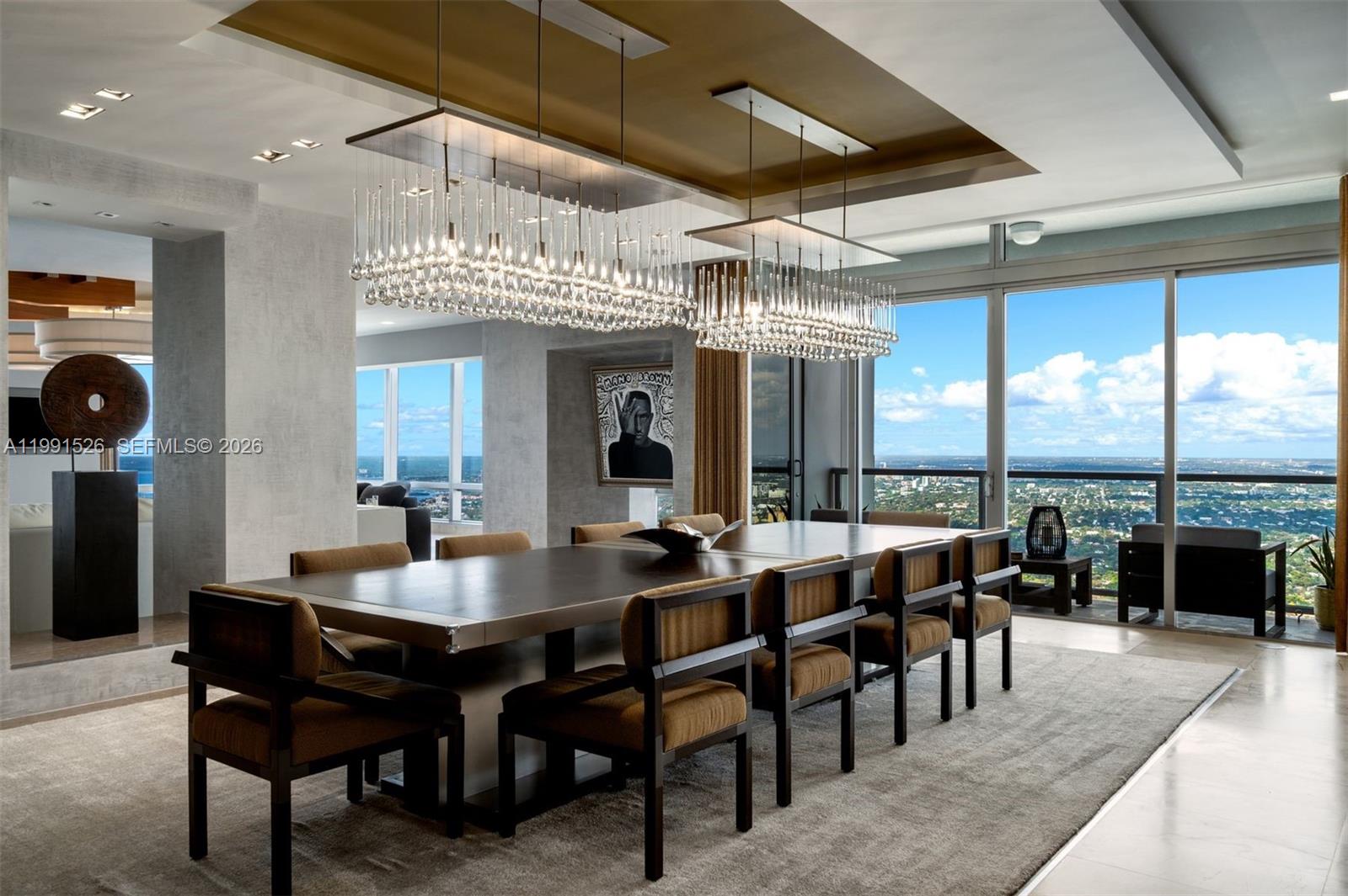 1425 Brickell Avenue, Unit PH2ABCD Miami, FL 33131 - Photo 3 of 20 a view of a dining room with furniture window and outside view