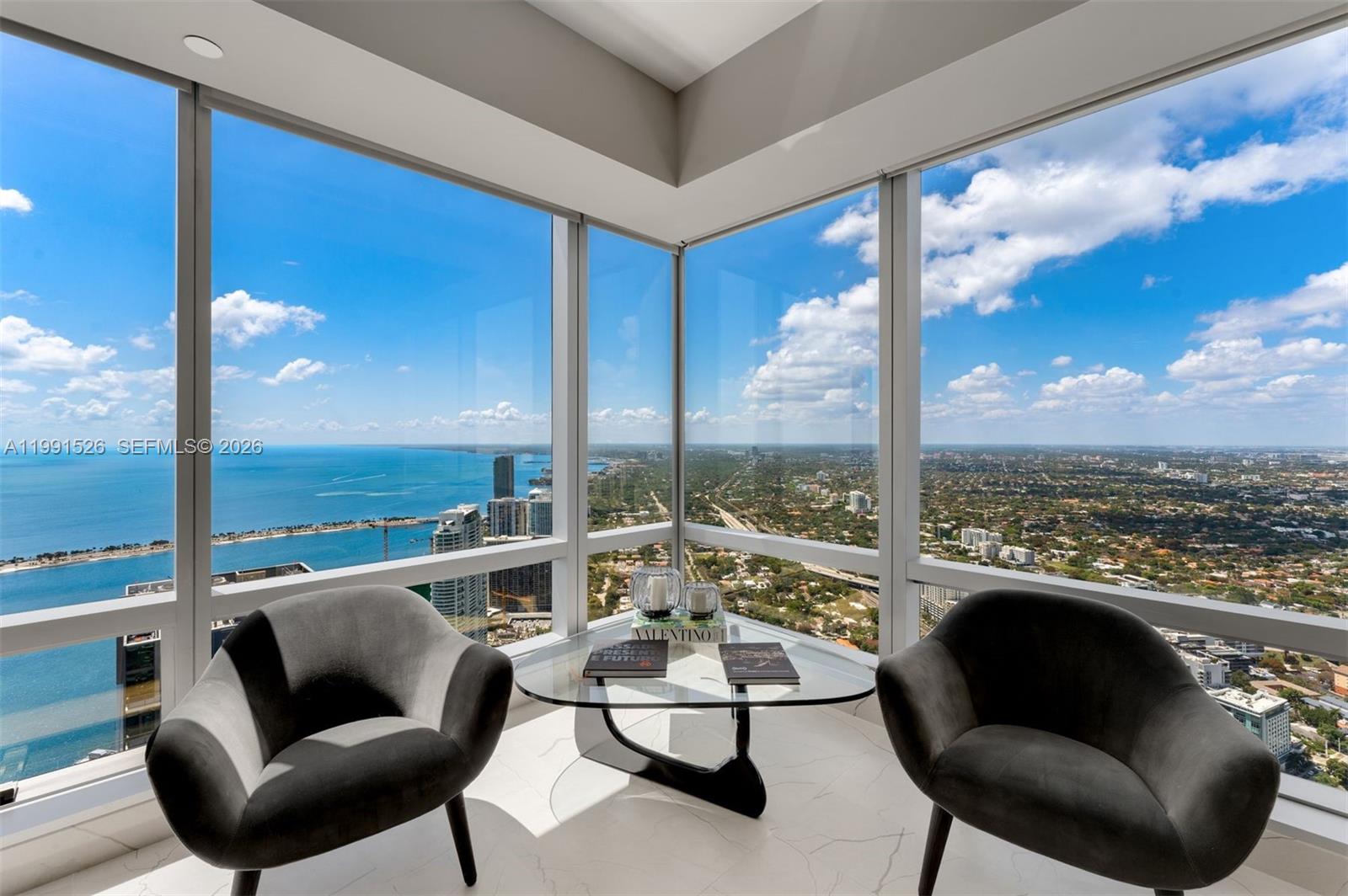 1425 Brickell Avenue, Unit PH2ABCD Miami, FL 33131 - Photo 4 of 20 a balcony with furniture and city view
