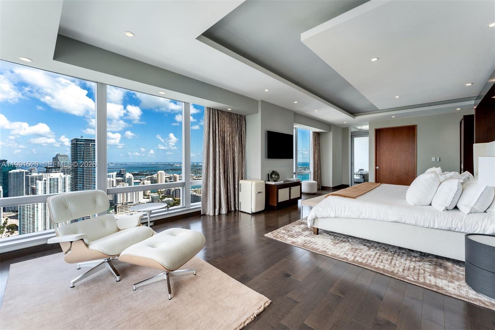 1425 Brickell Avenue, Unit PH2ABCD Miami, FL 33131 - Photo 7 of 20 a living room with furniture and a large window