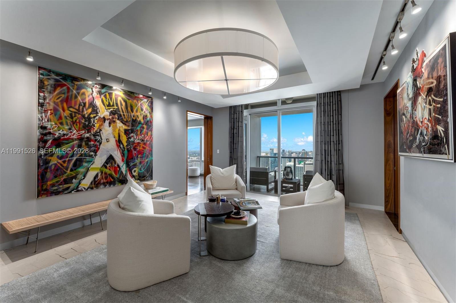 1425 Brickell Avenue, Unit PH2ABCD Miami, FL 33131 - Photo 8 of 20 a living room with furniture and a large window