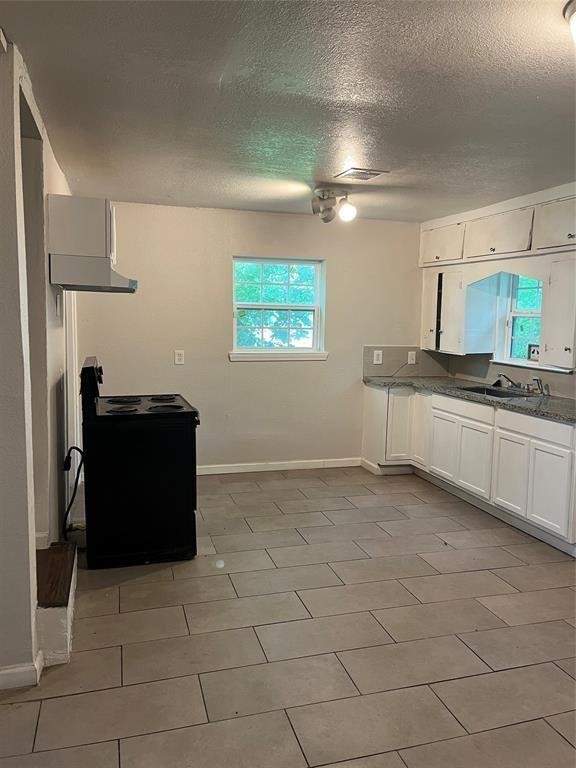 7227 St Augustine Street Houston, TX 77021 - Photo 12 of 20 a kitchen with stainless steel appliances granite countertop a sink and a refrigerator