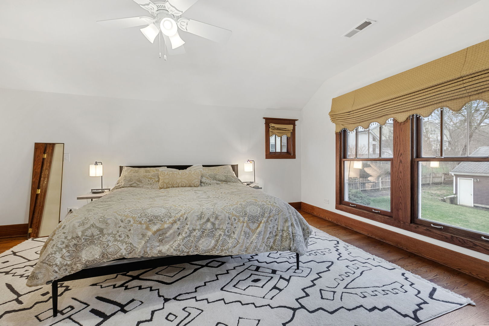 539 South Cook Street Barrington, IL 60010 - Photo 12 of 25 a bedroom with a large bed and a window