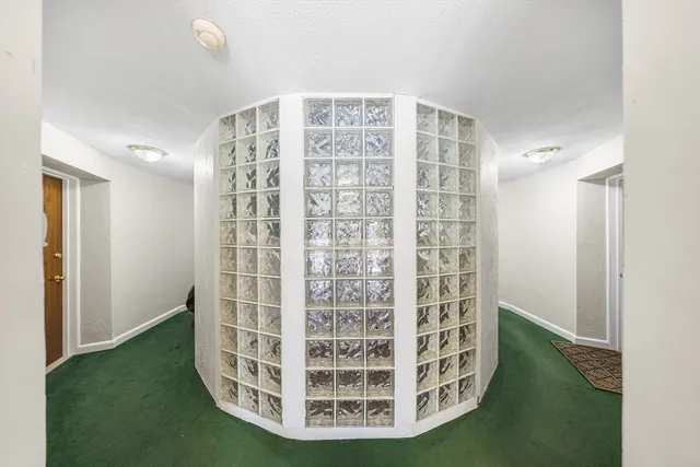 a view of staircase with white walls