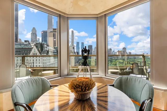 a living room with furniture and a book shelf