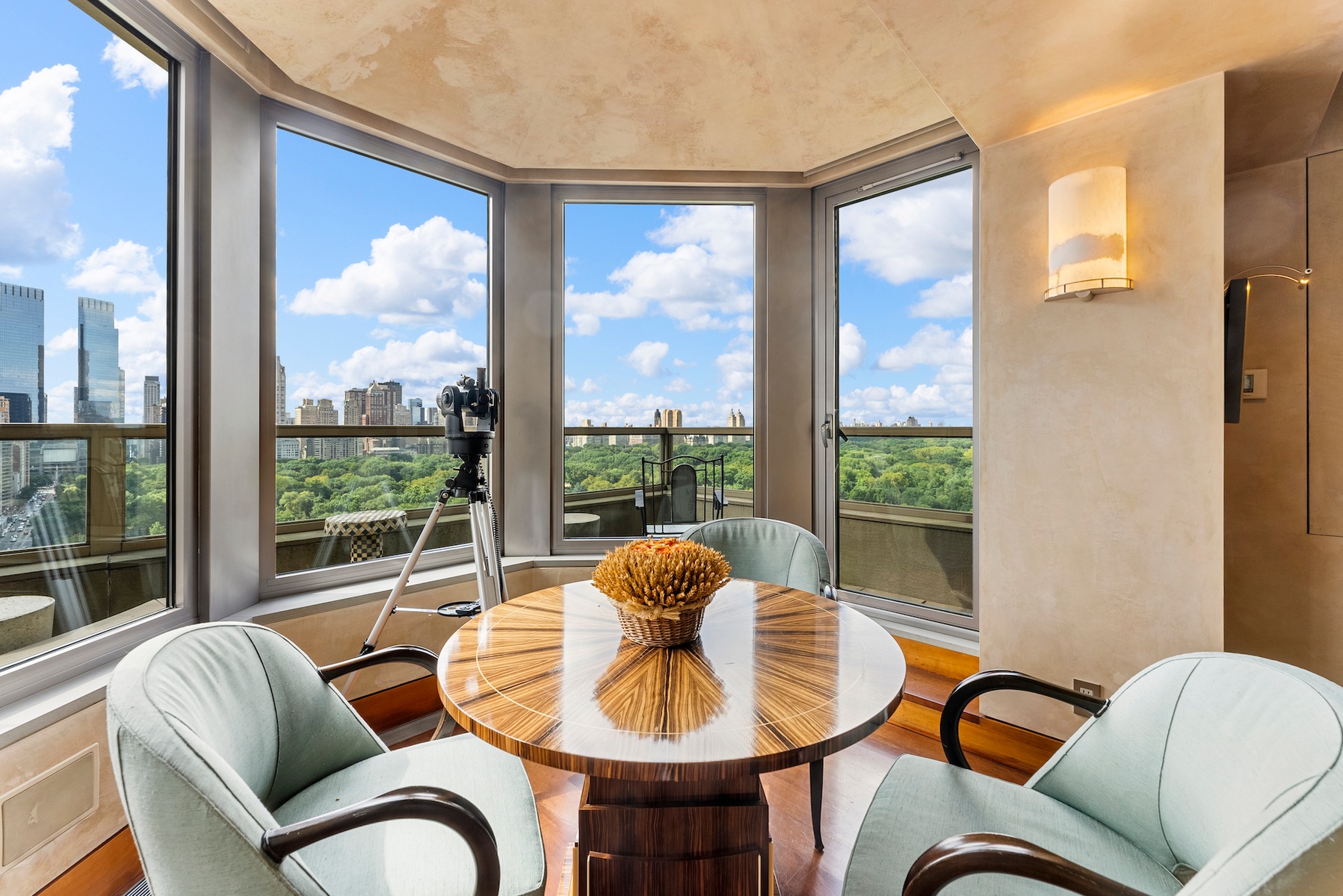 781 5th Avenue, Unit 2001 Manhattan, NY 10022 - Photo 13 of 19 a living room with couches and a potted plant