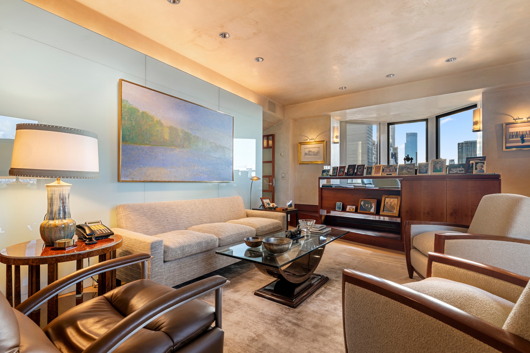 781 5th Avenue, Unit 2001 Manhattan, NY 10022 - Photo 6 of 19 a living room with furniture a rug and a lamp