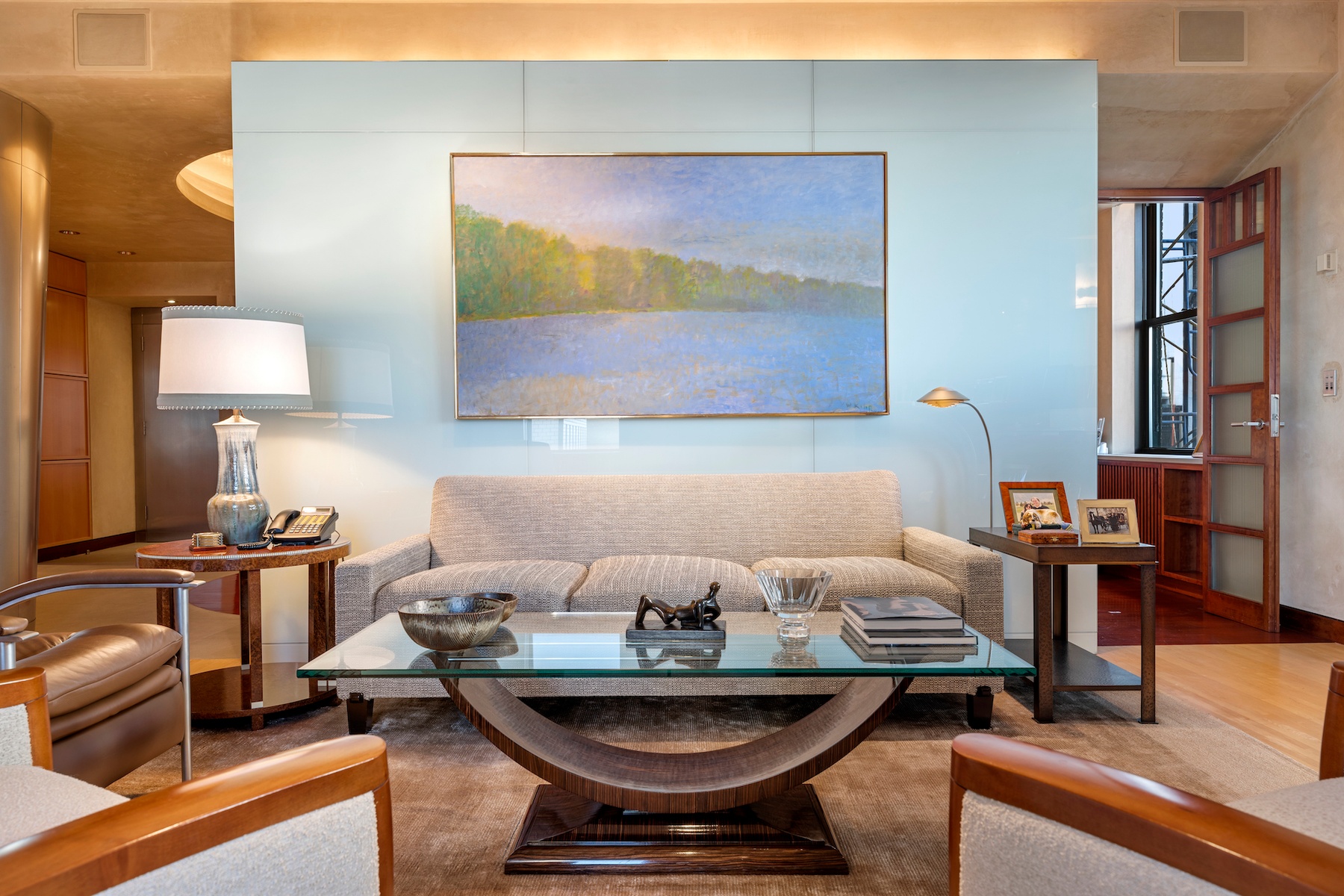 781 5th Avenue, Unit 2001 Manhattan, NY 10022 - Photo 7 of 19 a living room with furniture and a lamp