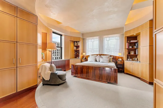 a living room with furniture and a lamp