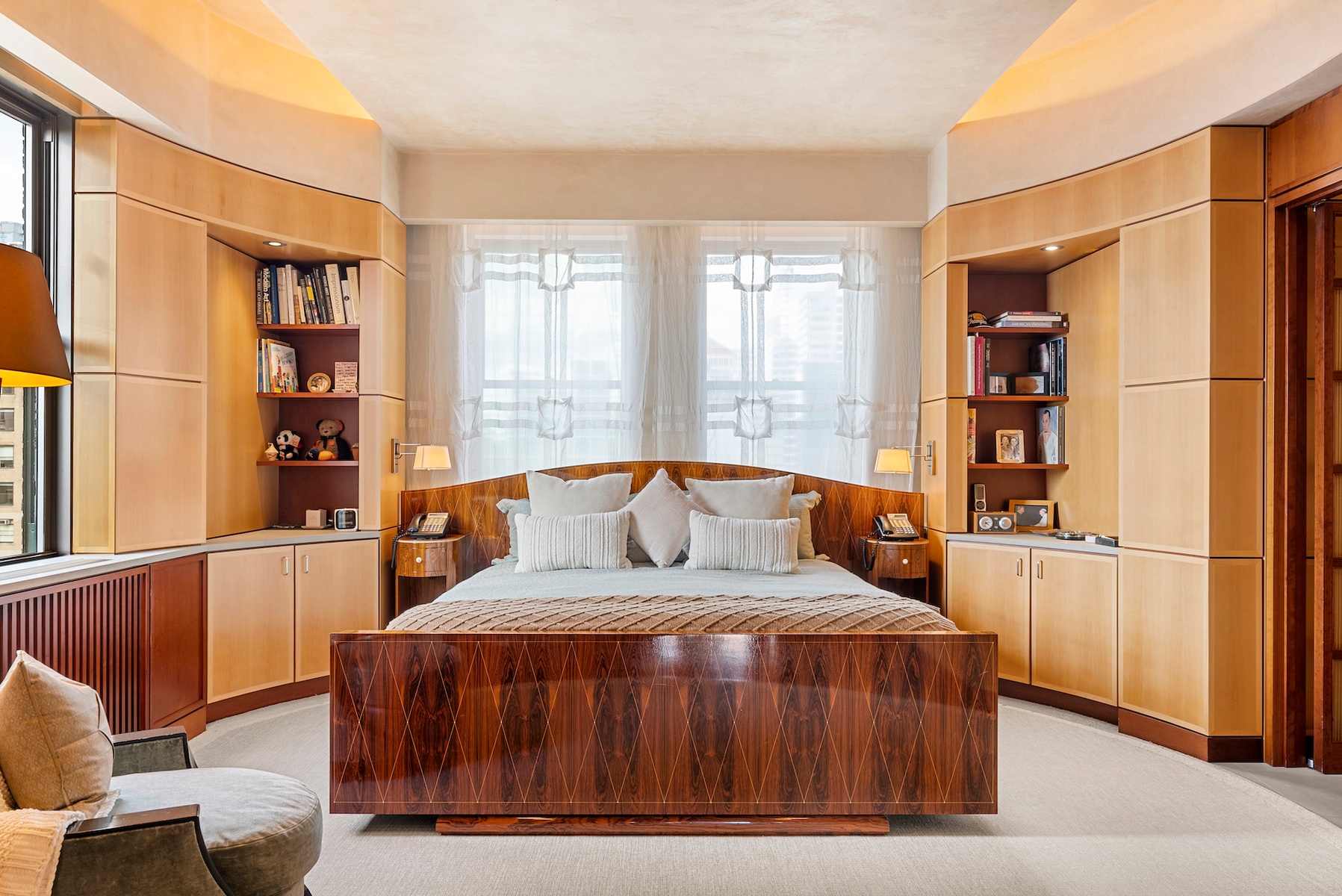 781 5th Avenue, Unit 2001 Manhattan, NY 10022 - Photo 9 of 19 a bedroom with a large bed and a window