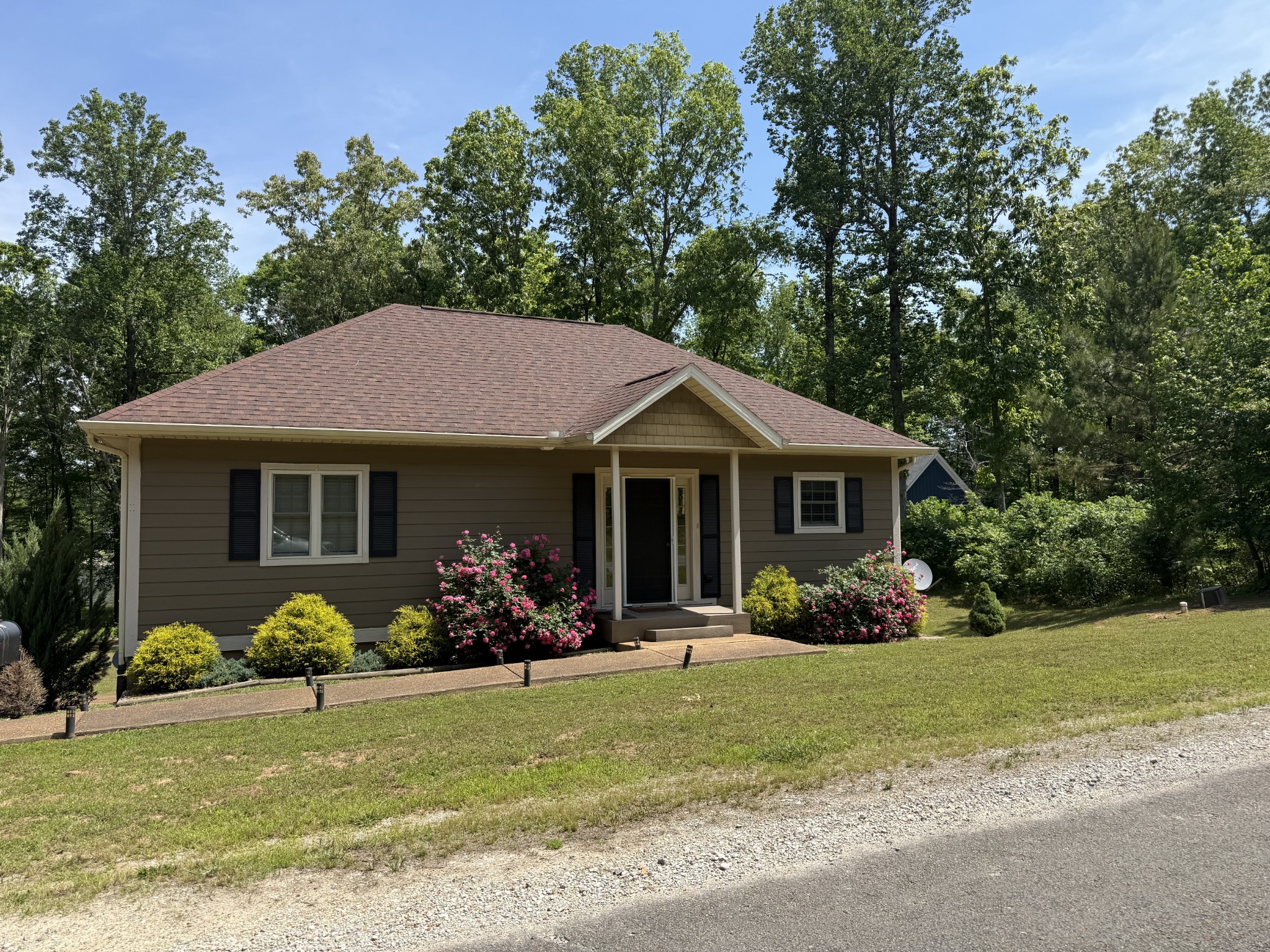 a front view of a house with garden