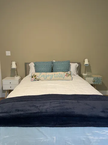 a backyard of a house with large trees