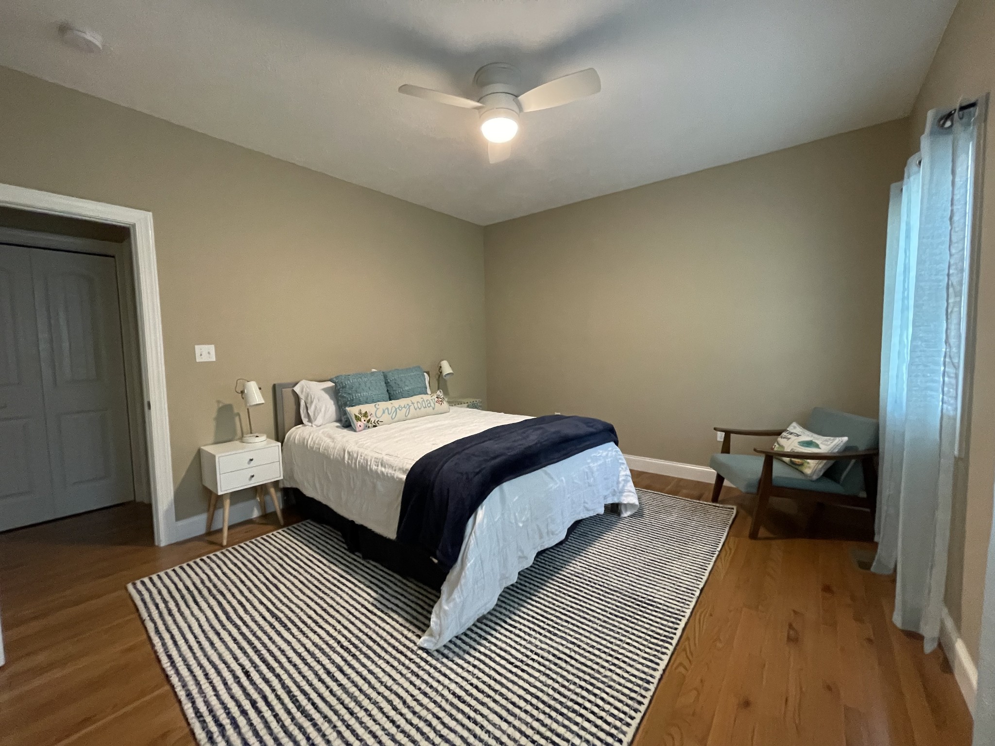 1751 Excalibur Trail Cedar Grove, TN 38321 - Photo 29 of 47 a spacious bedroom with a bed and wooden floor