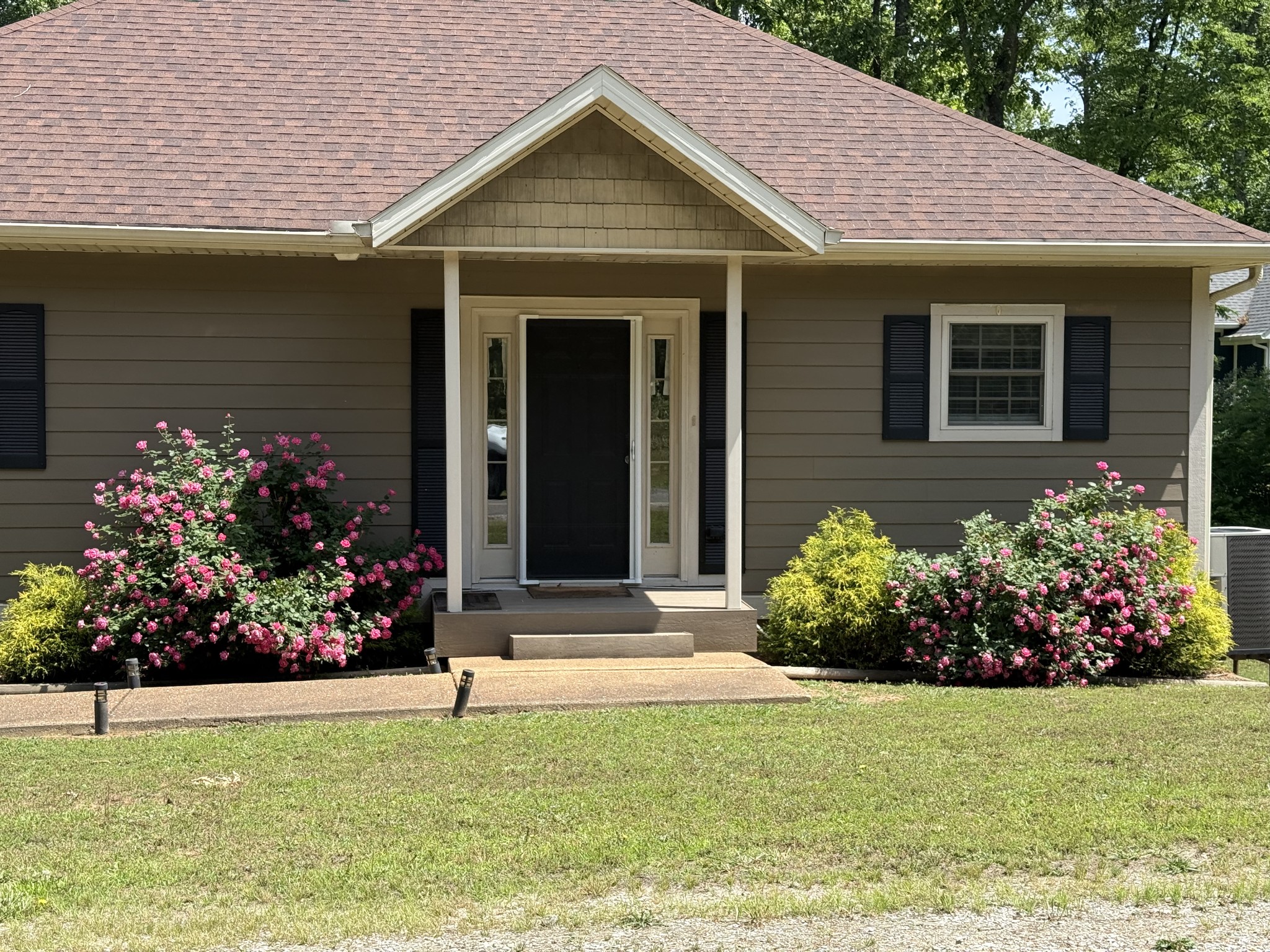 1751 Excalibur Trail Cedar Grove, TN 38321 - Photo 46 of 47 a front view of a house with a garden