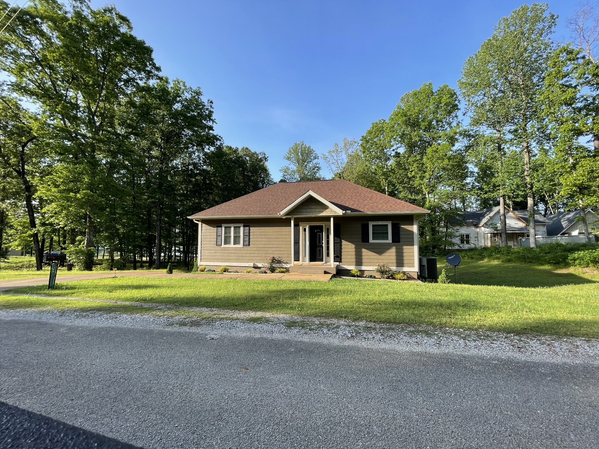 1751 Excalibur Trail Cedar Grove, TN 38321 - Photo 8 of 47 a front view of a house with a yard and trees