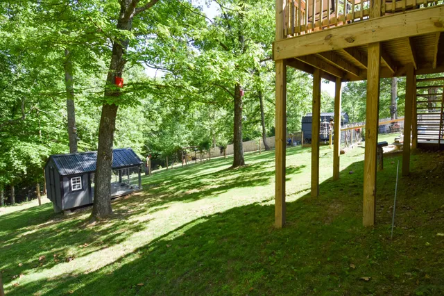 a view of balcony with wooden floor and outdoor seating