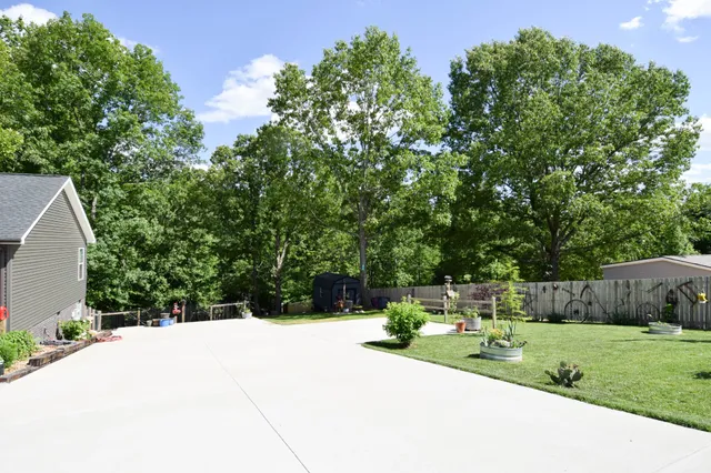 a front view of a house with a yard table and chairs