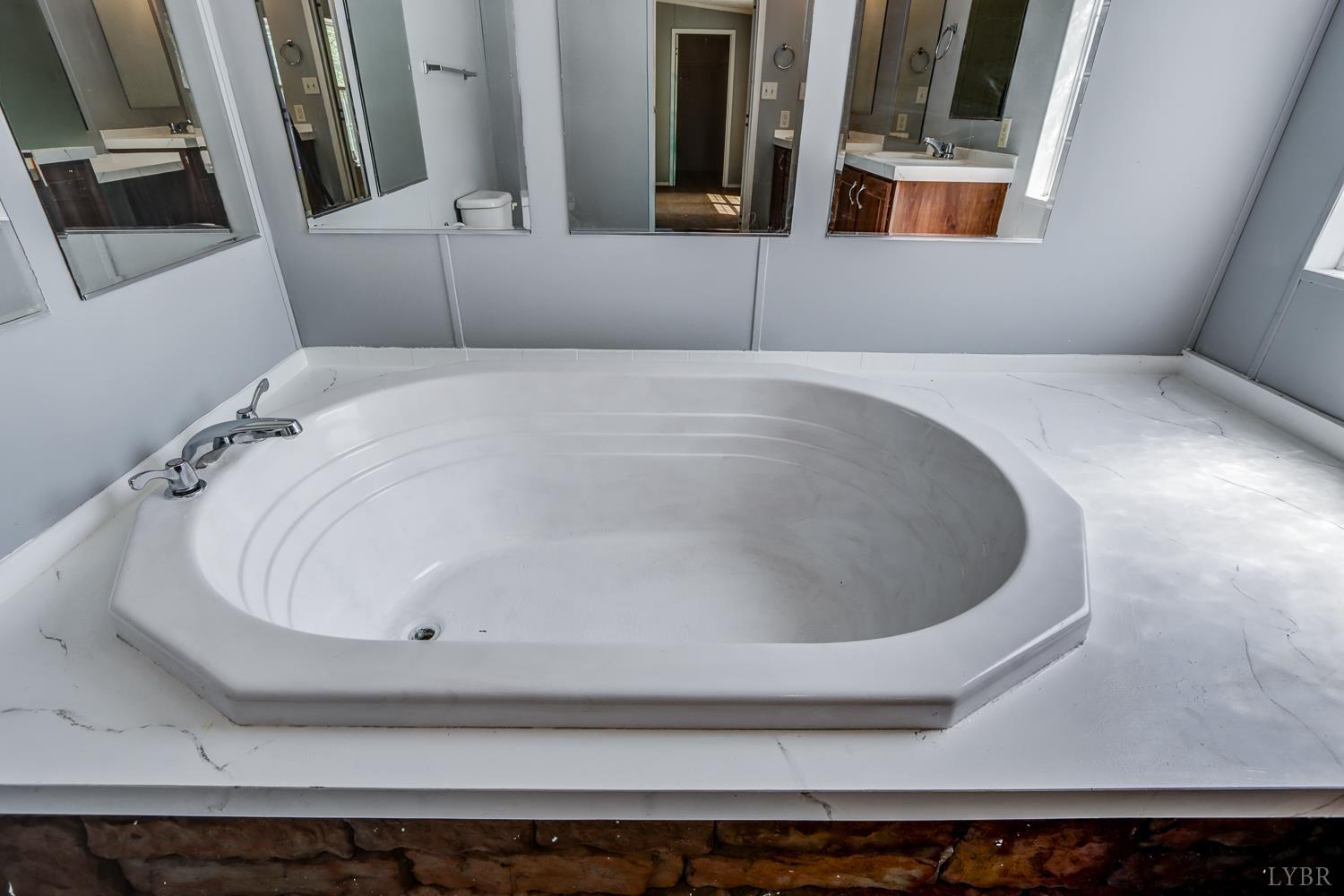 102 Slow Water Court Sandy Level, VA 24161 - Photo 29 of 66 a bathroom with a bathtub