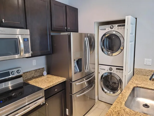 a view of a kitchen with washer and dryer