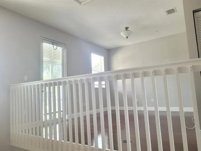 a view of a porch with wooden floor