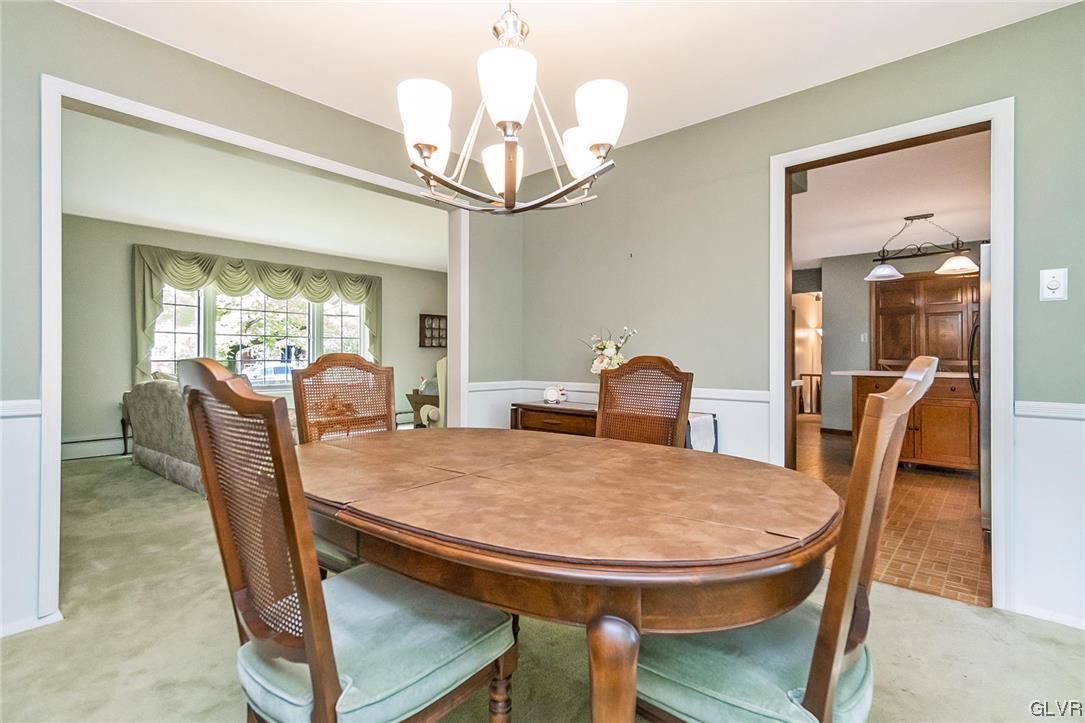 7116 Linden Road Lower Macungie Township, PA 18062 - Photo 15 of 41 a view of a dining room with furniture window and wooden floor
