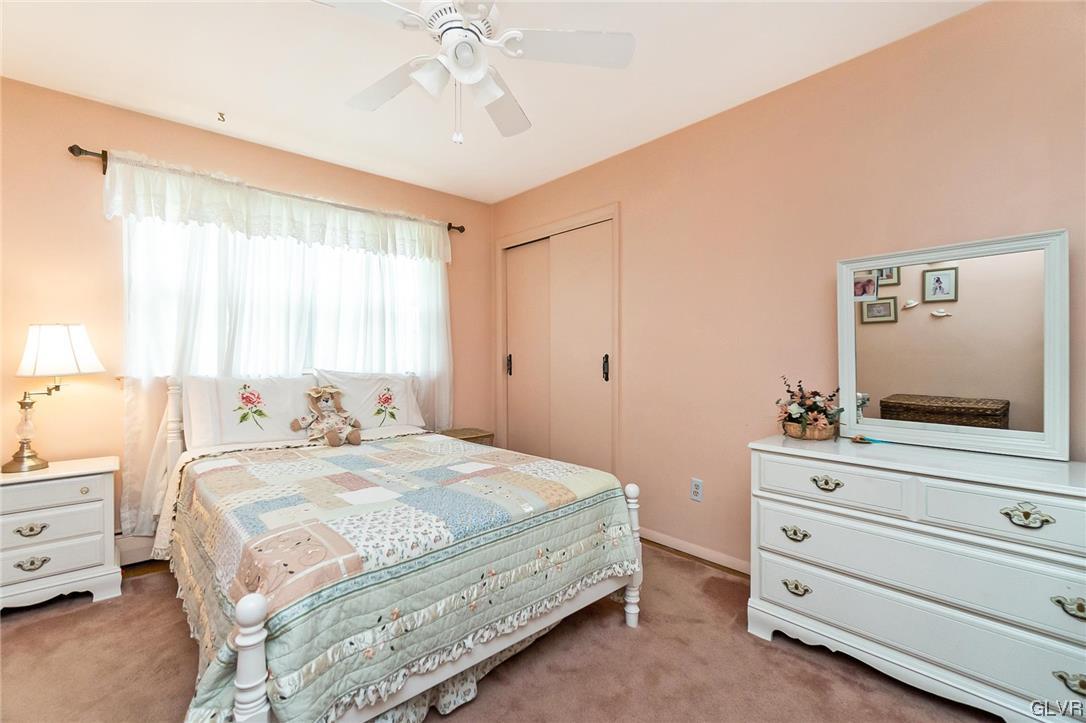 7116 Linden Road Lower Macungie Township, PA 18062 - Photo 27 of 41 a bedroom with a bed and a flat screen tv