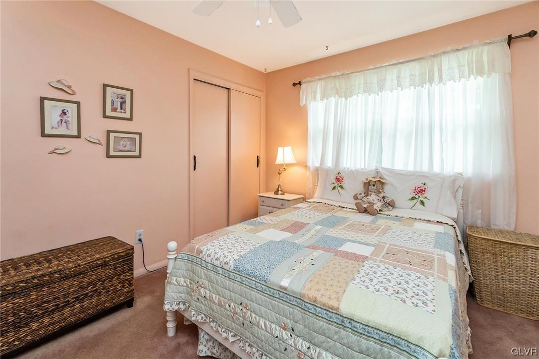 7116 Linden Road Lower Macungie Township, PA 18062 - Photo 28 of 41 a bedroom with a bed and wooden floor