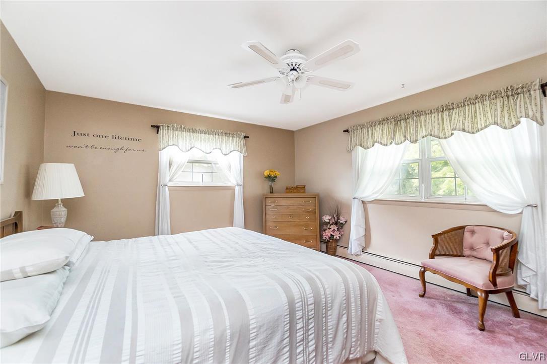7116 Linden Road Lower Macungie Township, PA 18062 - Photo 31 of 41 a bedroom with a large bed and a chair