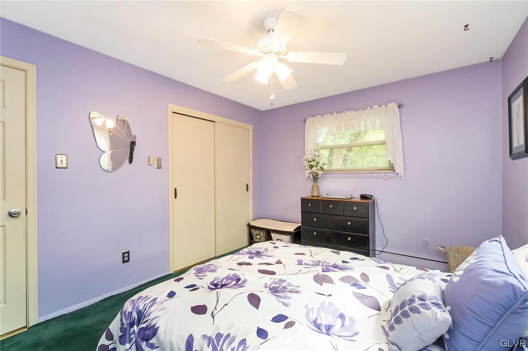 7116 Linden Road Lower Macungie Township, PA 18062 - Photo 34 of 41 a bedroom with a bed and a chandelier