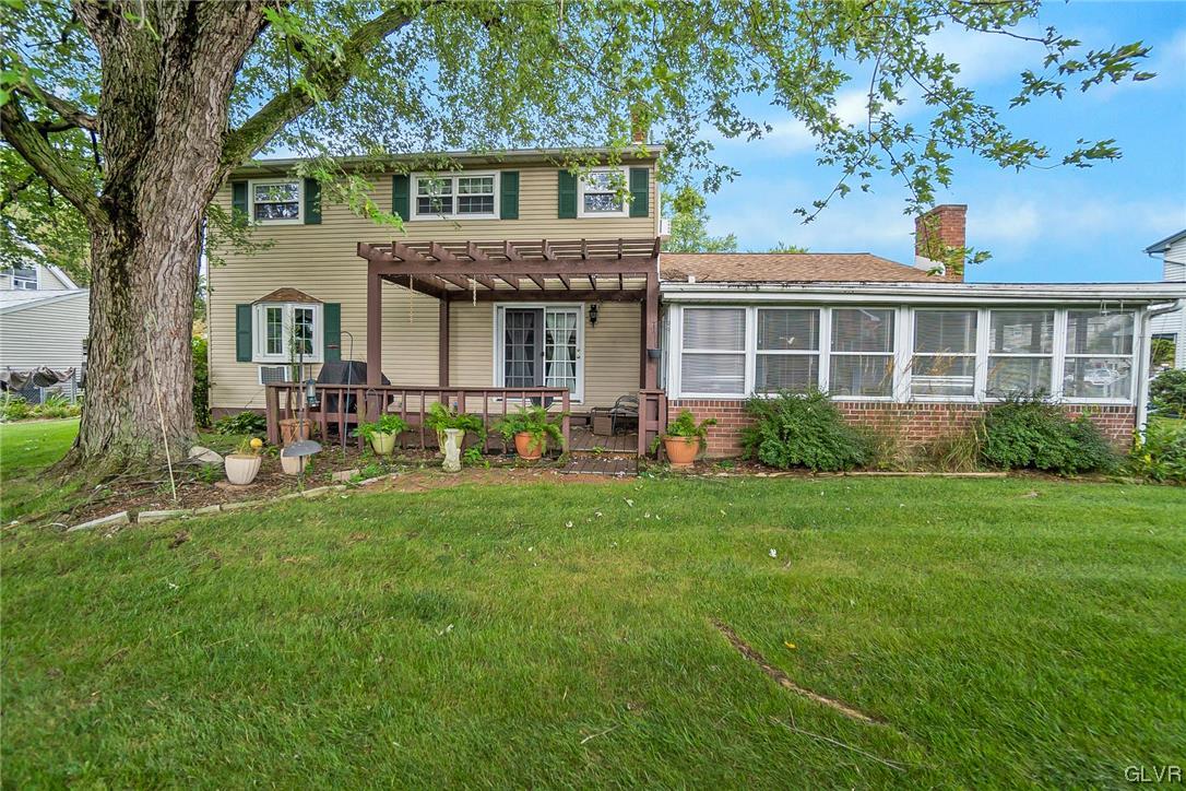 7116 Linden Road Lower Macungie Township, PA 18062 - Photo 39 of 41 a front view of a house with a garden and porch