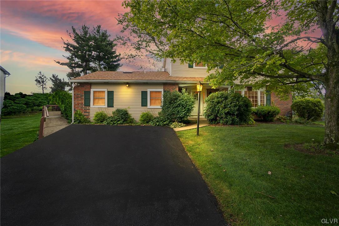 7116 Linden Road Lower Macungie Township, PA 18062 - Photo 41 of 41 a front view of a house with a yard and trees