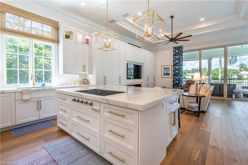 2125 Modena Court Naples, FL 34105 - Photo 15 of 50 a kitchen with a stove a sink and a refrigerator