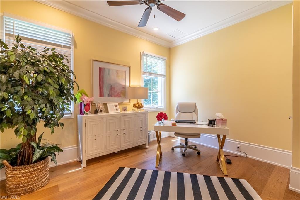 2125 Modena Court Naples, FL 34105 - Photo 23 of 50 a workspace with furniture and a potted plant